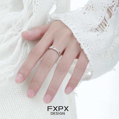 Elegant FXPX dopamine colored zircon ring showcased on a hand with a stylish white sweater