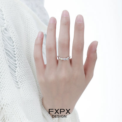 Elegant FXPX dopamine colored zircon ring showcased on a hand with a delicate design