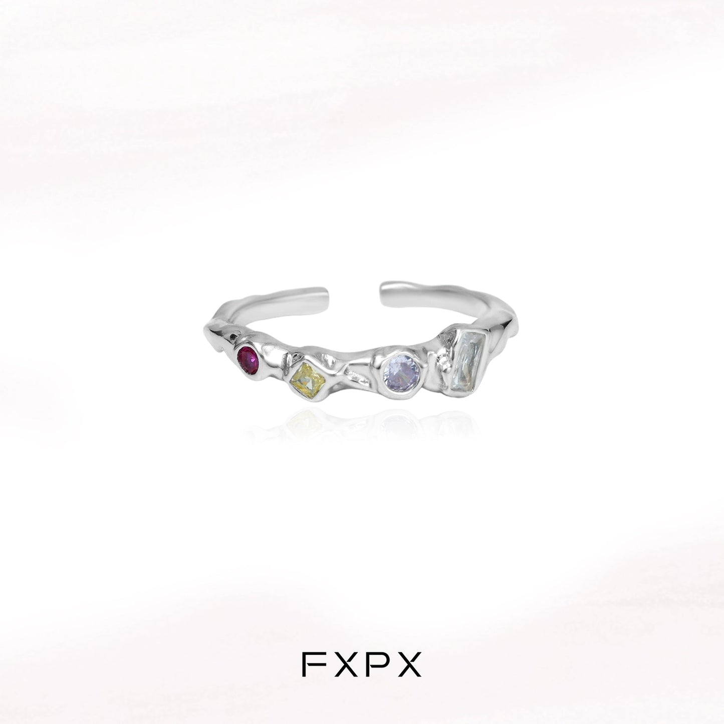 FXPX dopamine colored zircon ring with unique gemstone arrangement and modern design