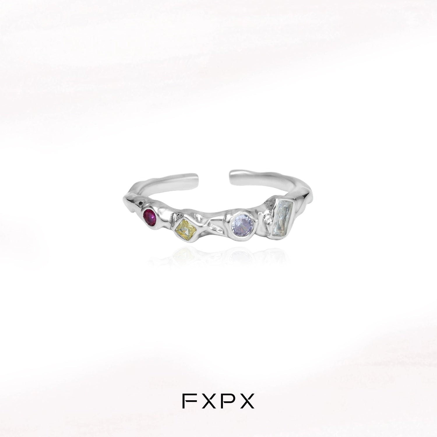 FXPX dopamine colored zircon ring with unique gemstone arrangement and modern design