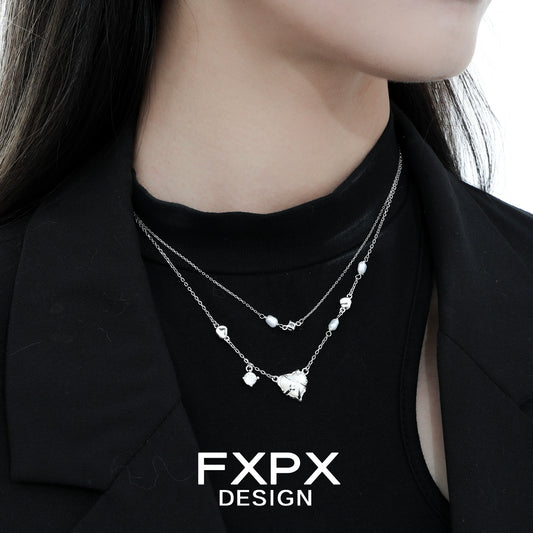 Double layer silver love necklace with delicate charms, featuring an elegant design for everyday wear