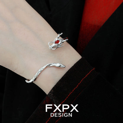 FXPX dragon guardian silver bracelet featuring a detailed dragon design with red accent