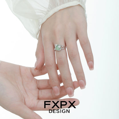 Elegant FXPX eagle claw gemstone ring set on a model's hand, showcasing its unique design