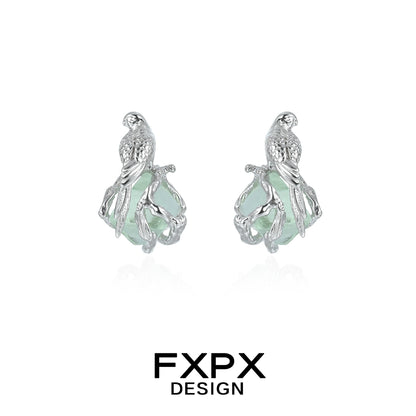 Silver FXPX flying bird fluorite earrings with detailed bird design and elegant gemstone setting