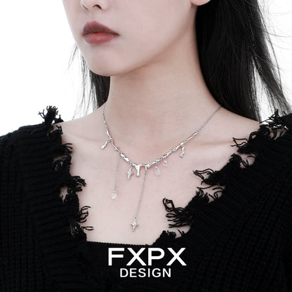 Stylish FXPX galactic meteor tassel necklace on a model with a chic black sweater