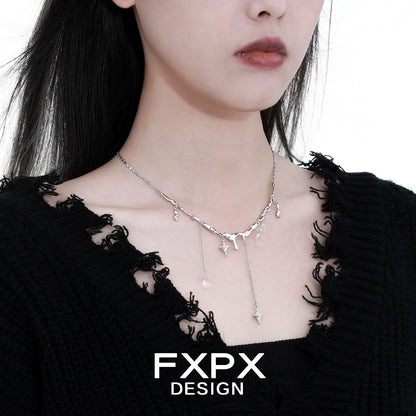 FXPX Galactic Meteor Tassel Necklace with Silver Chains and Star Accents on a Model