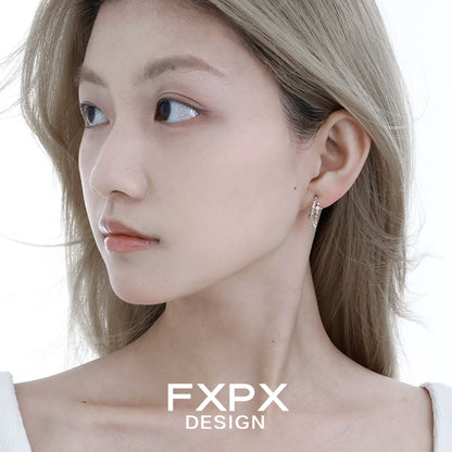 Elegant FXPX geometry silver earrings showcased on a model's ear for a stylish look