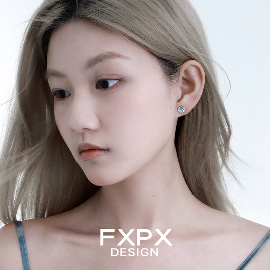 Elegant FXPX glacier drop earrings showcased on a model with light hair and minimal makeup