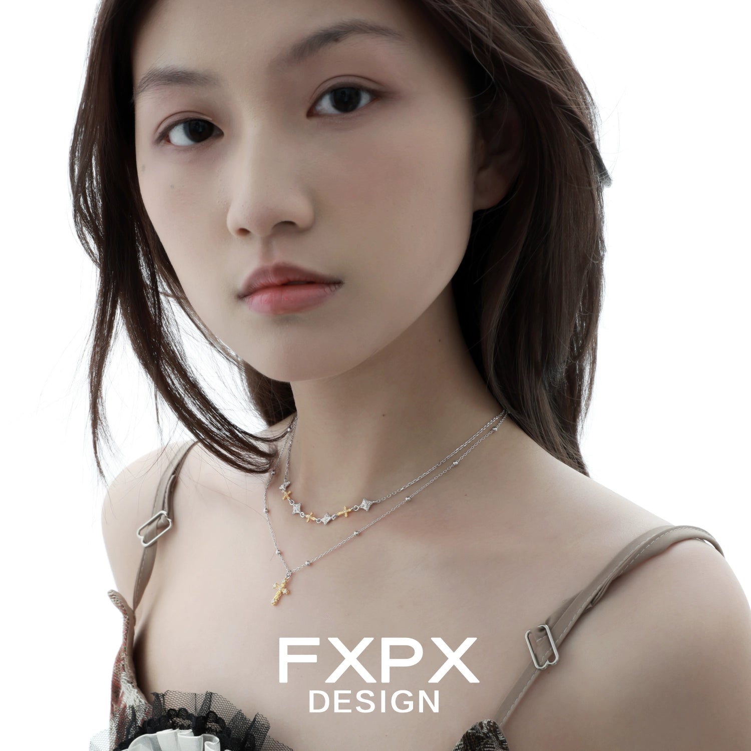 Stylish FXPX gold faith cross necklace worn layered for a trendy look