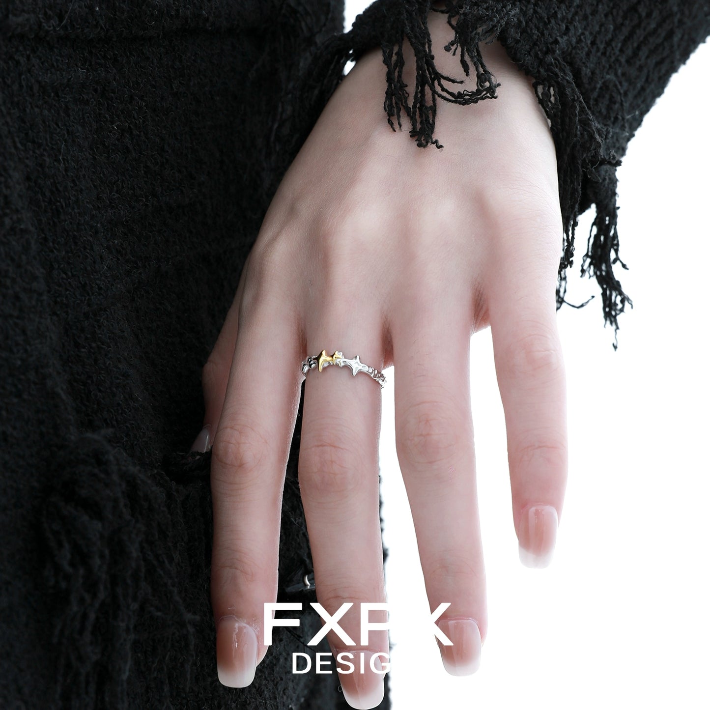 Stylish gold star ring by FXPX showcased on a model's hand with unique design
