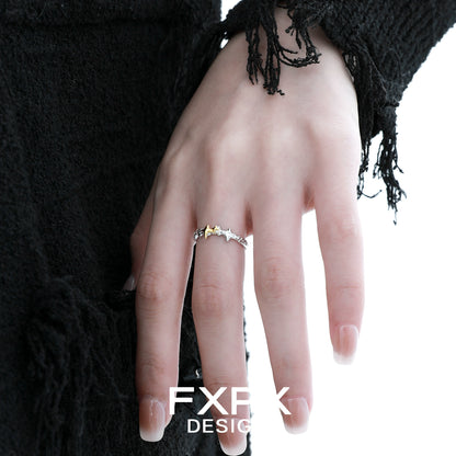 Stylish gold star ring by FXPX showcased on a model's hand with unique design