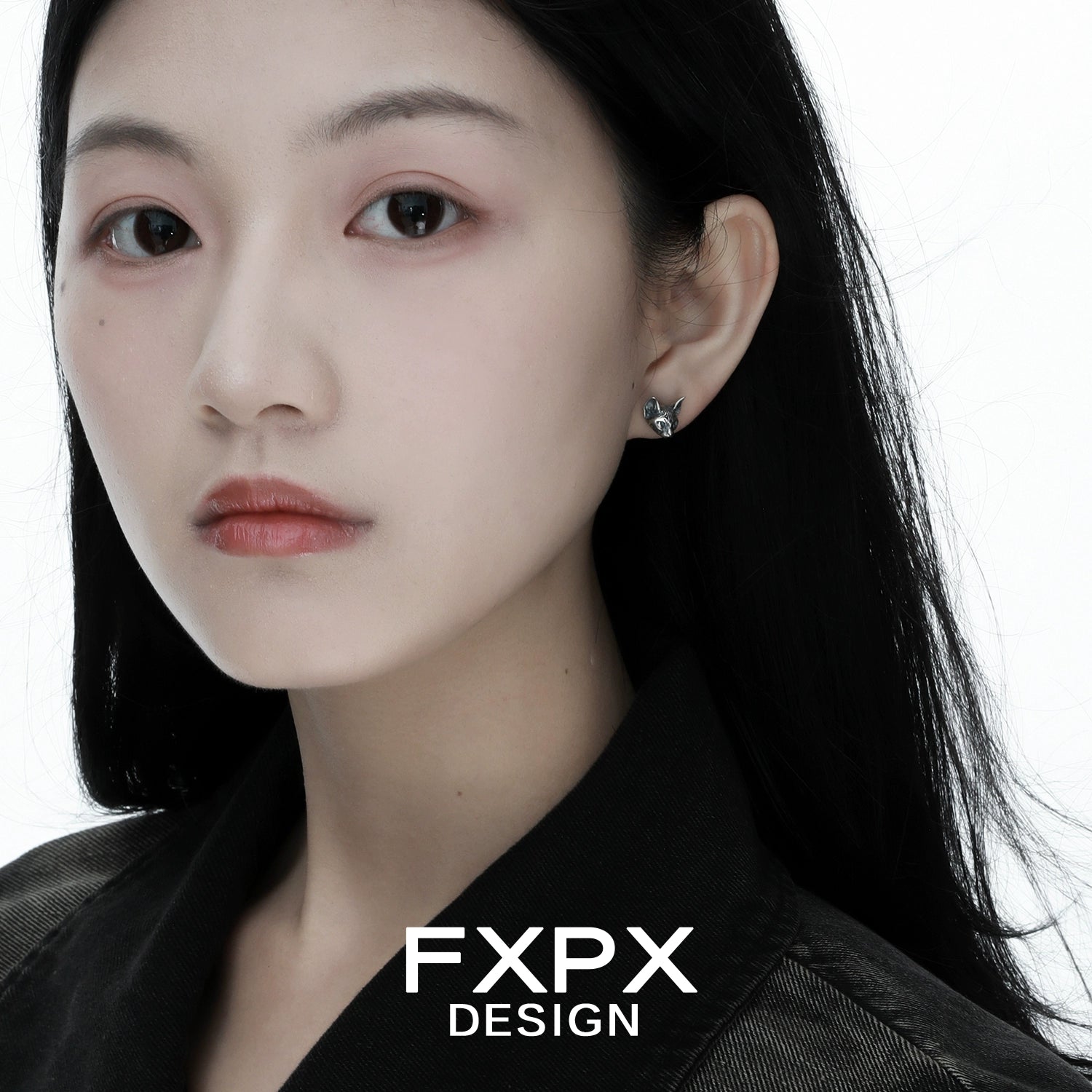 Stylish model wearing FXPX gothic cat earrings in silver for a trendy look
