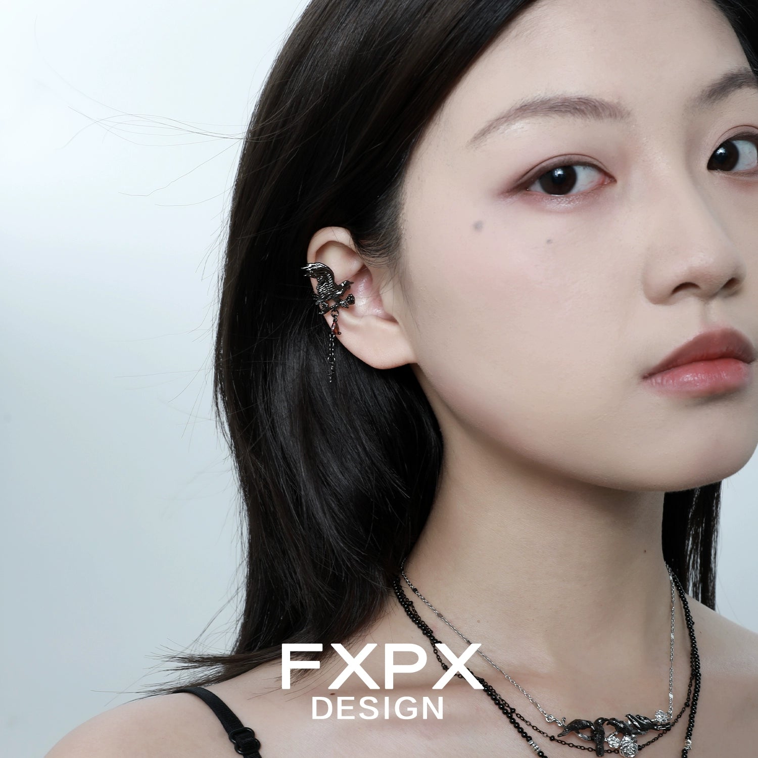 Stylish FXPX gothic crow ear cuffs worn by a model showcasing unique design and elegance