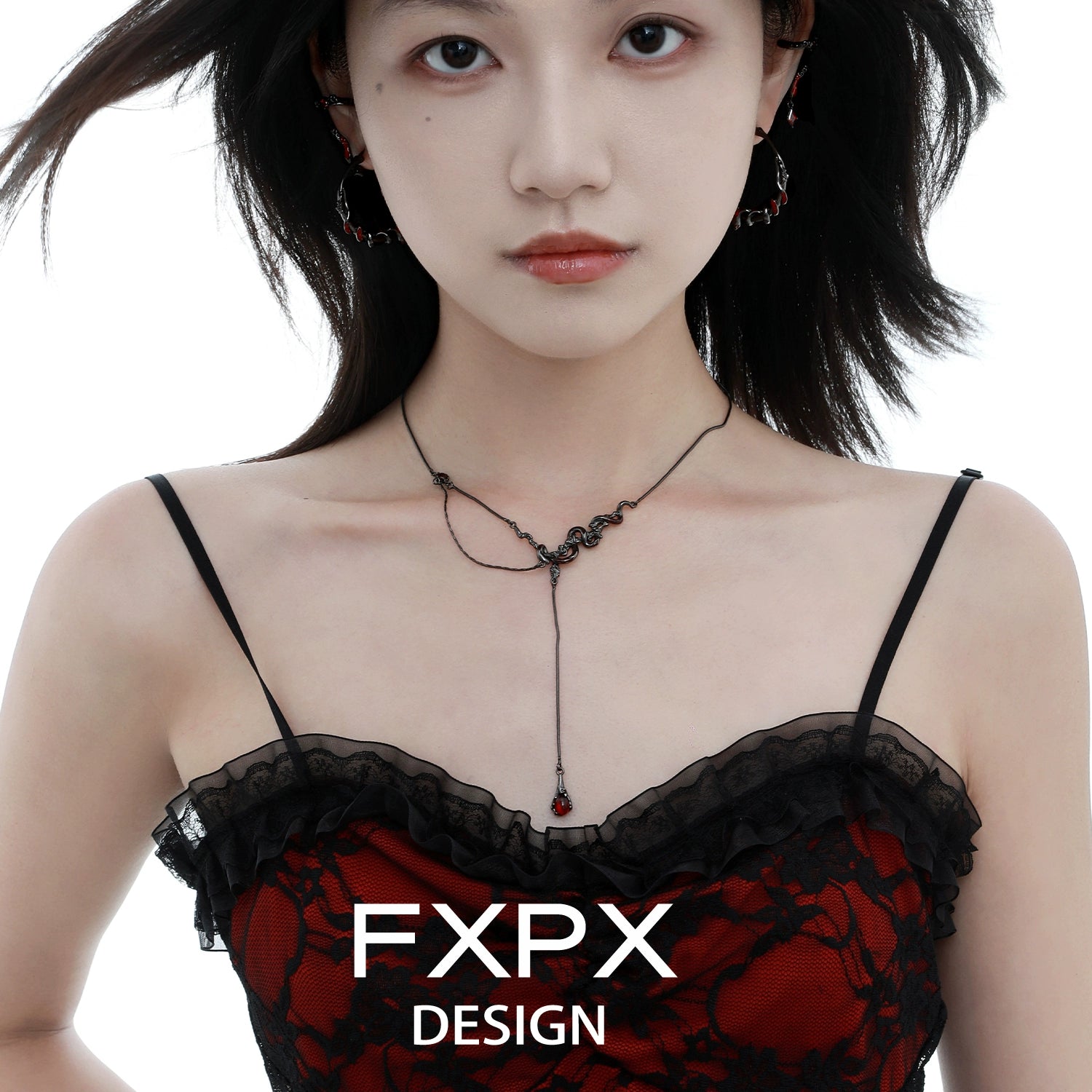 Gothic snake necklace featured on model with elegant lace top for a trendy statement look