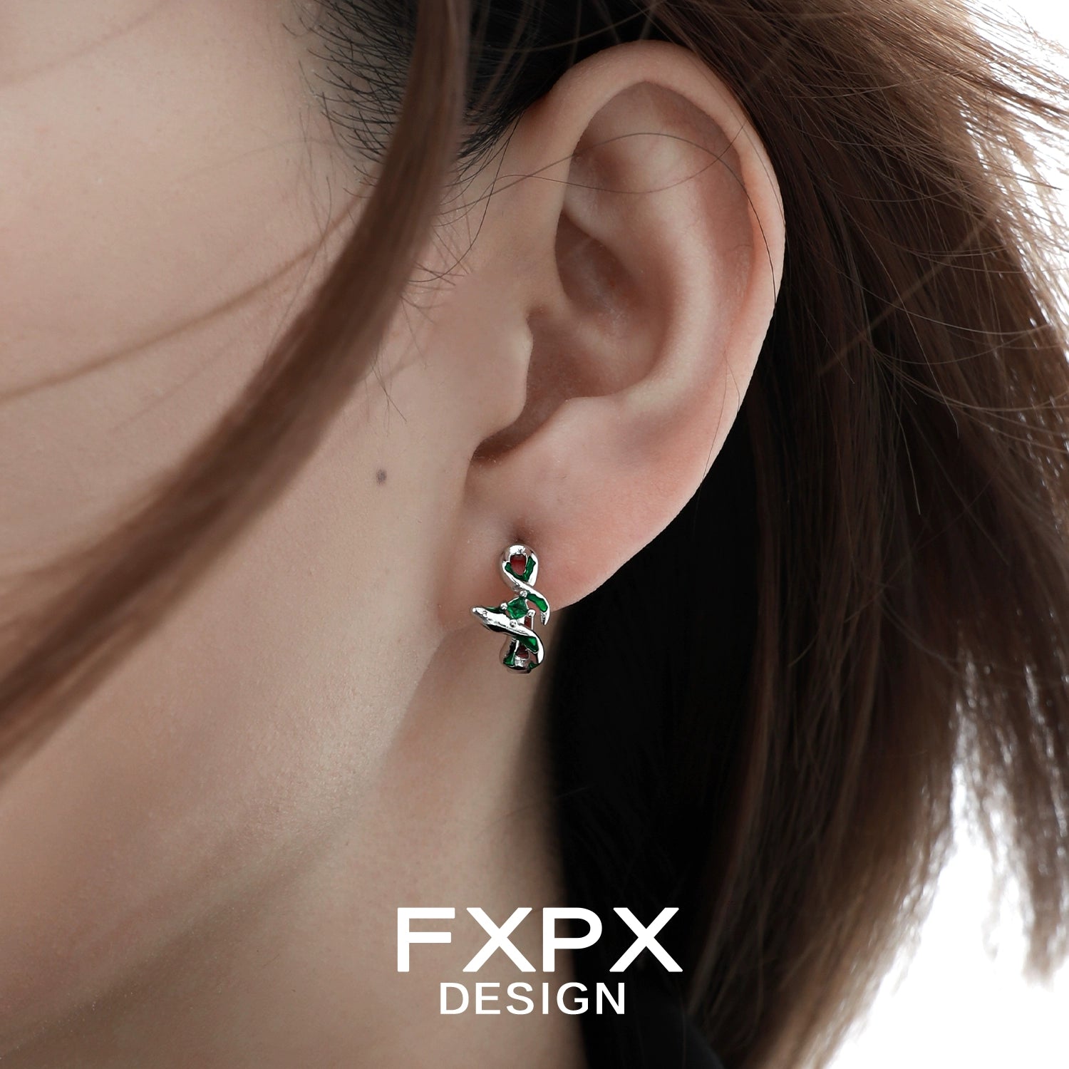 Stylish FXPX green snake earrings featuring a unique coiled design and elegant finish