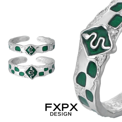 Unique FXPX green snake ring in silver with detailed snake design and emerald green accents