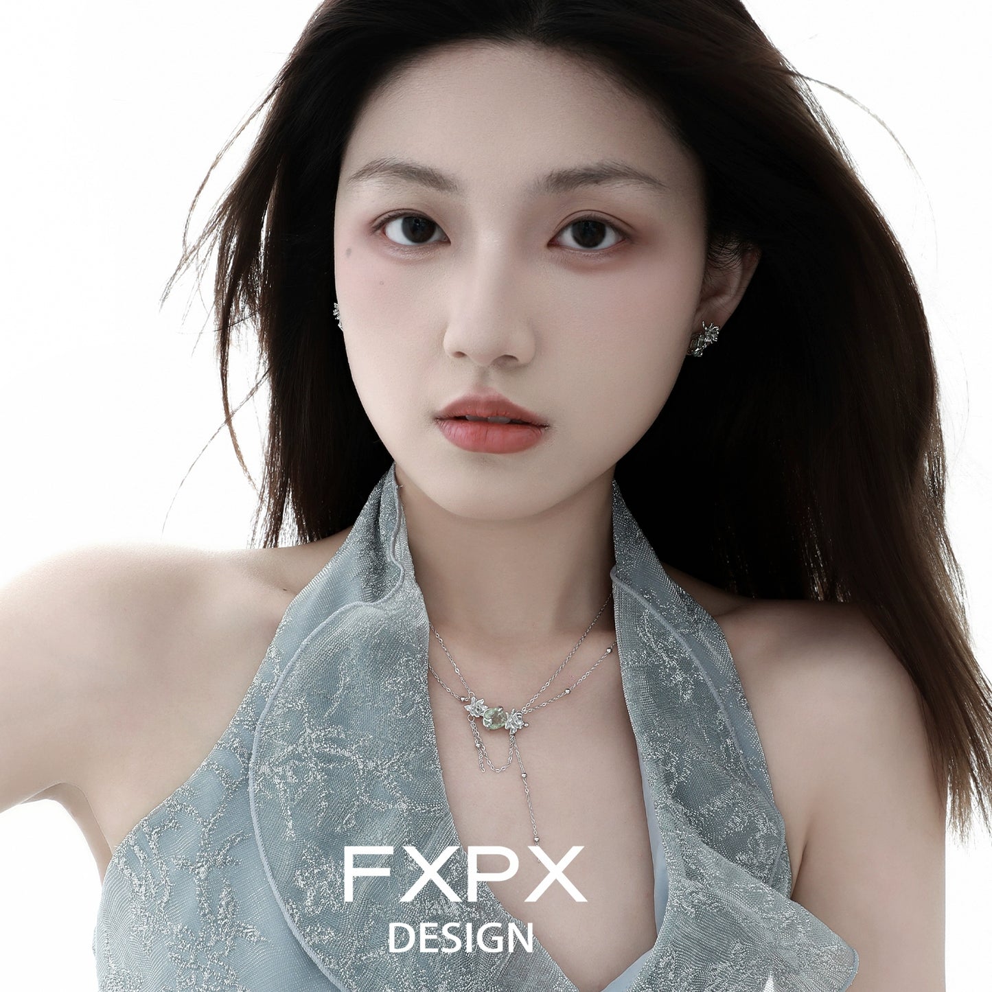 Elegant model wearing a green zircon double layer necklace, showcasing its shimmering design and delicate charm