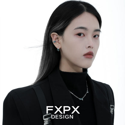 Elegant Iceland blue zircon stud earrings showcased on a model with sleek hair and stylish attire