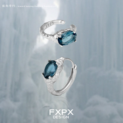 Elegant FXPX Iceland blue zircon stud earrings in sterling silver with intricate detailing