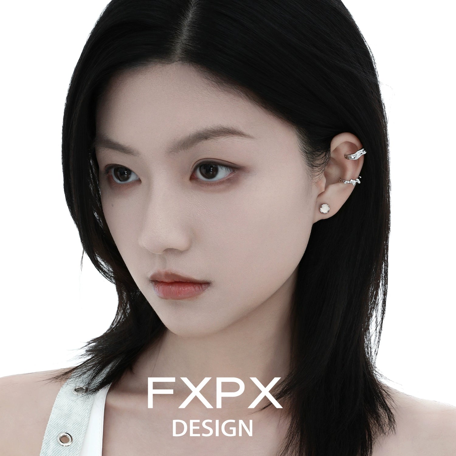 Irregular silver earrings designed by FXPX, showcasing a unique and modern style