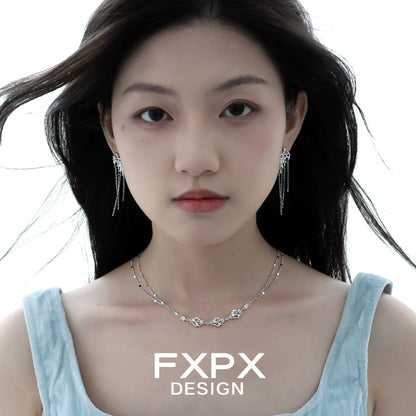Layered silver gothic necklace by FXPX worn by a model with matching earrings