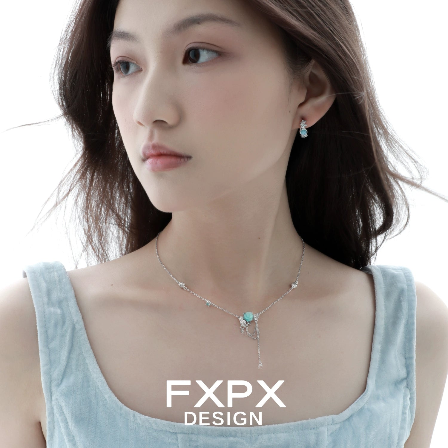 Elegant light blue rose pendant necklace paired with matching earrings for a stylish look