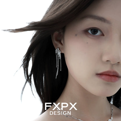 Stylish liquid metal tassel earrings dangling elegantly on a model's ear for a chic look