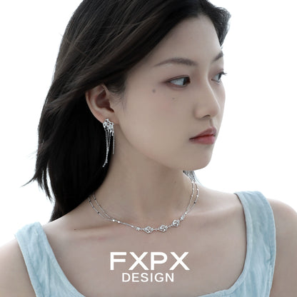 Elegant FXPX liquid metal tassel earrings with shimmering designs, perfect for stylish occasions