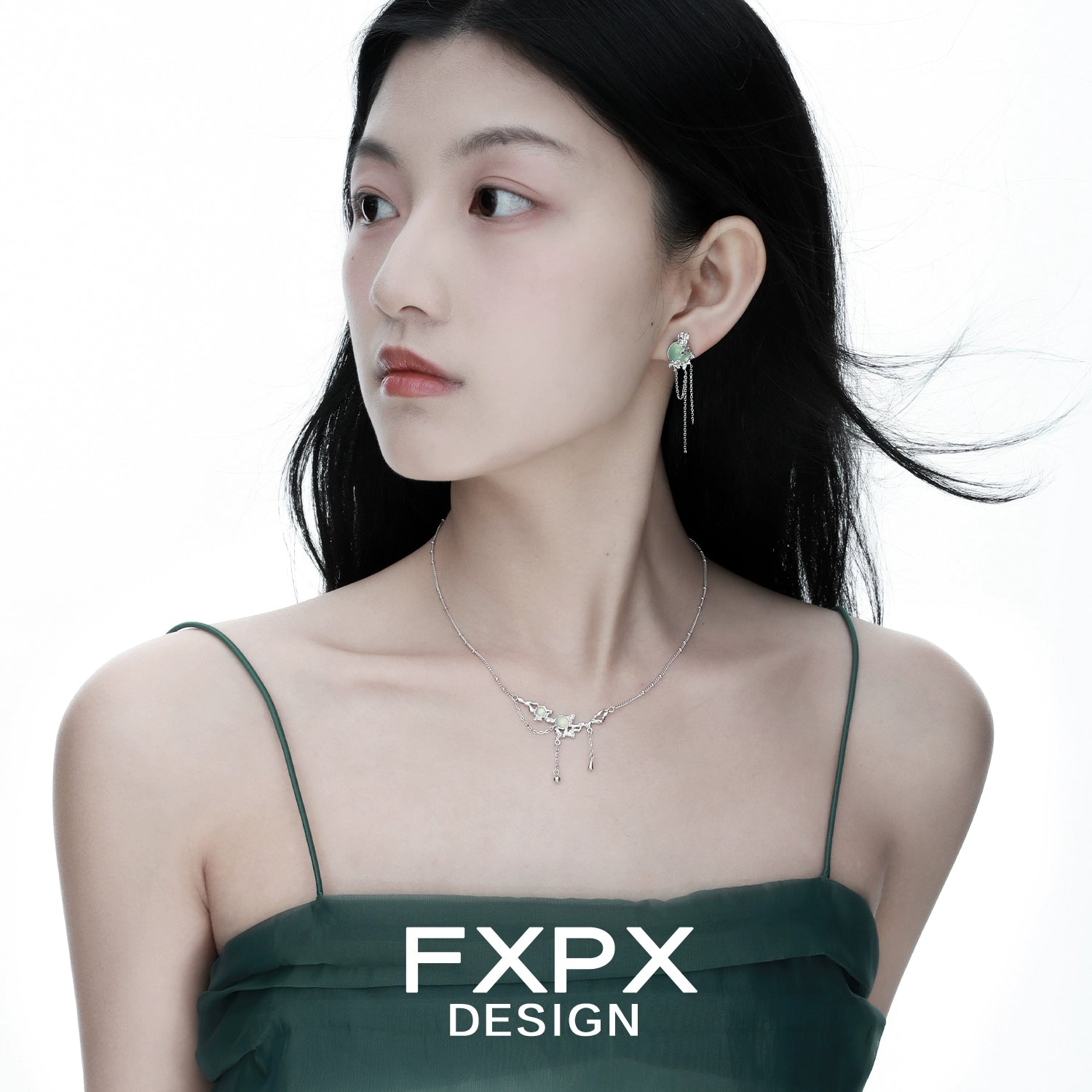 Elegant FXPX lotus pendant necklace displayed on a model with flowing hair and a stylish dress