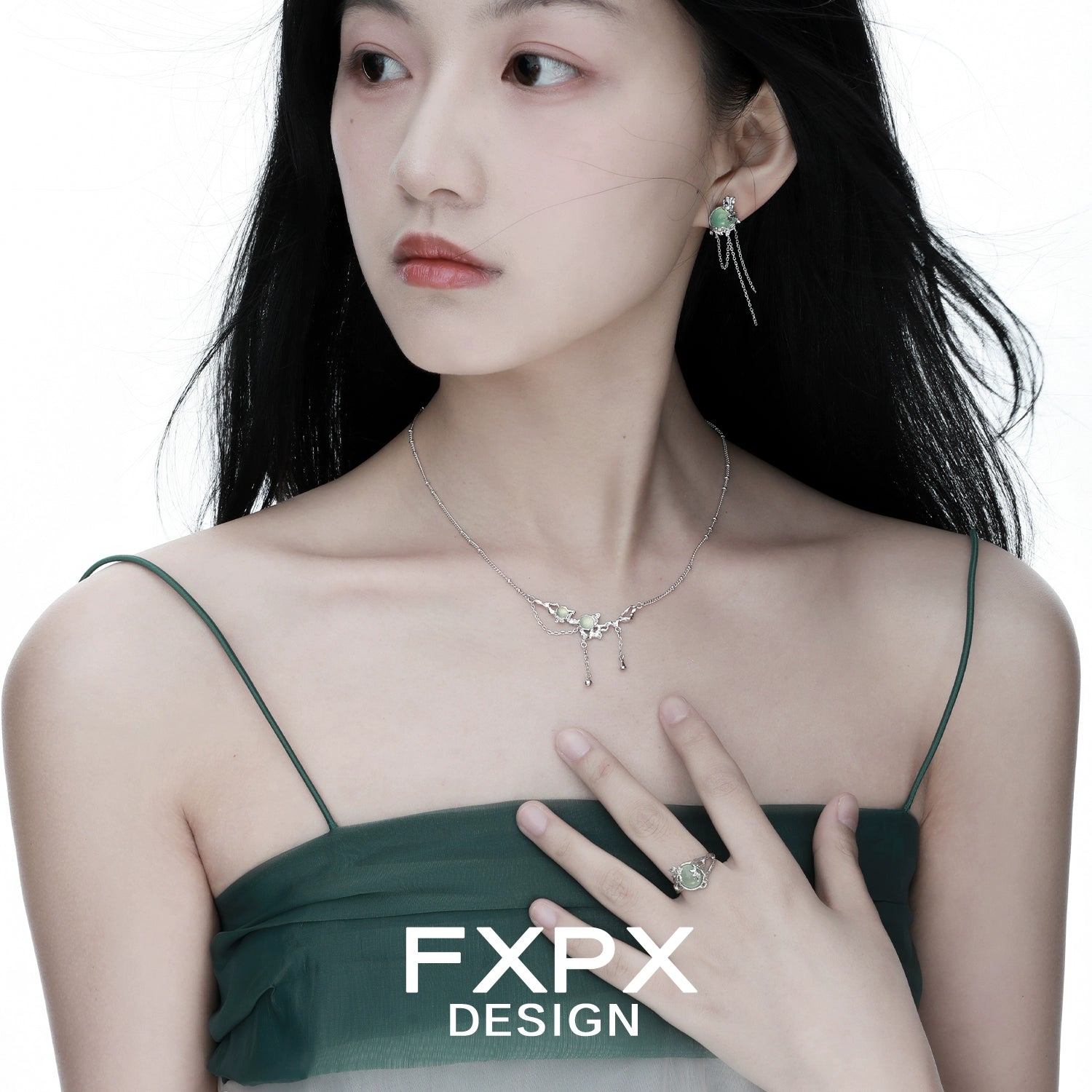 Stylish FXPX lotus pendant necklace worn by a model in a green dress, showcasing elegance and beauty