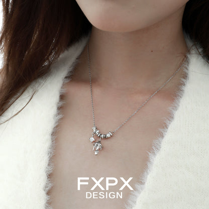 Stunning FXPX metal mushroom necklace with intricate design hanging on a delicate chain