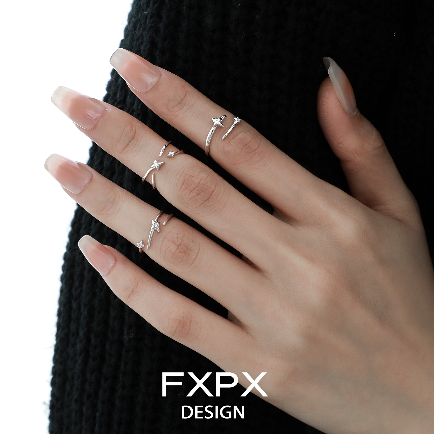 FXPX meteor track silver ring set on elegant fingers with a stylish design