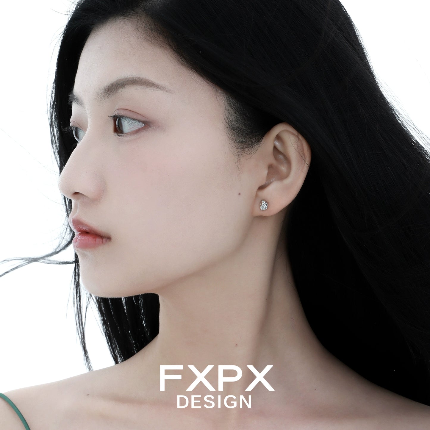 Elegant FXPX meteorite stud earrings showcased on a model for a chic and modern look
