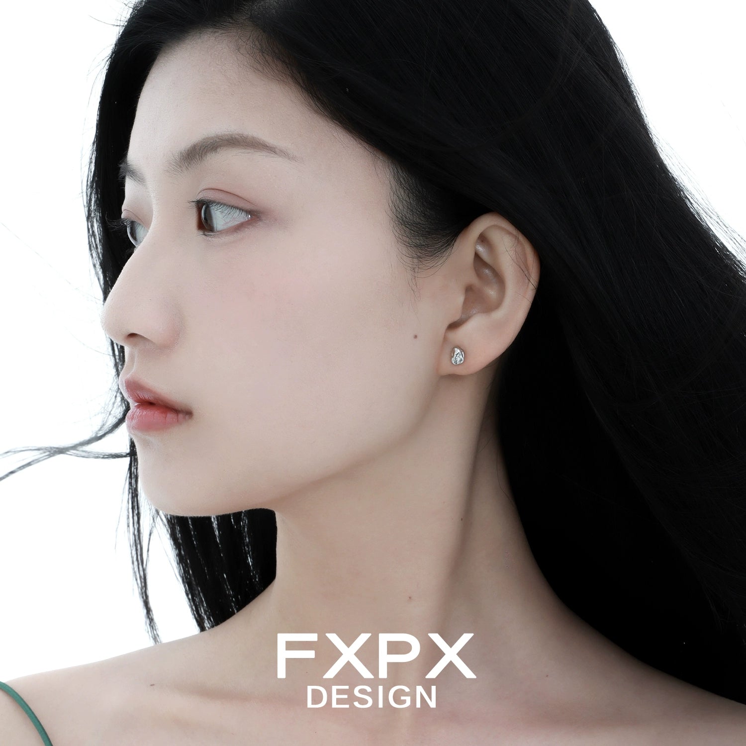 Elegant FXPX meteorite stud earrings showcased on a model for a chic and modern look
