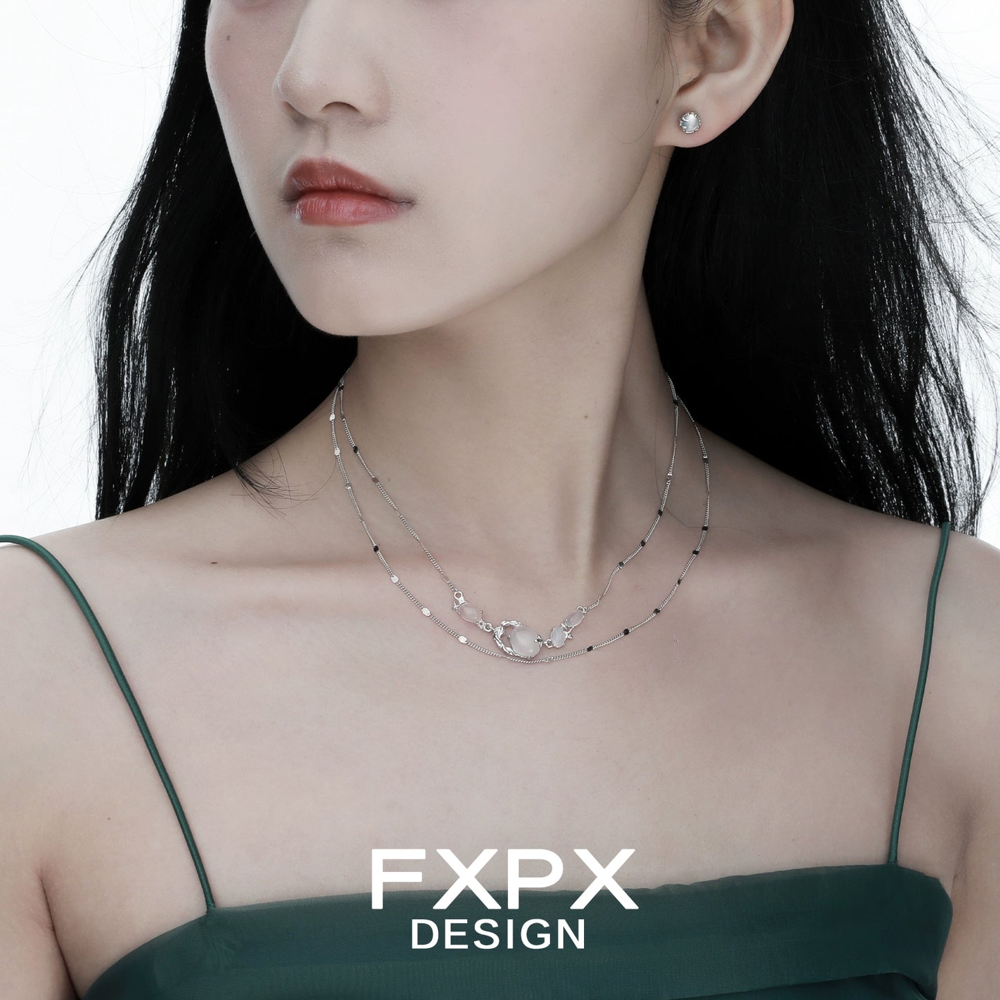 Elegant minimalist agate necklace layered with delicate silver chain for a chic look