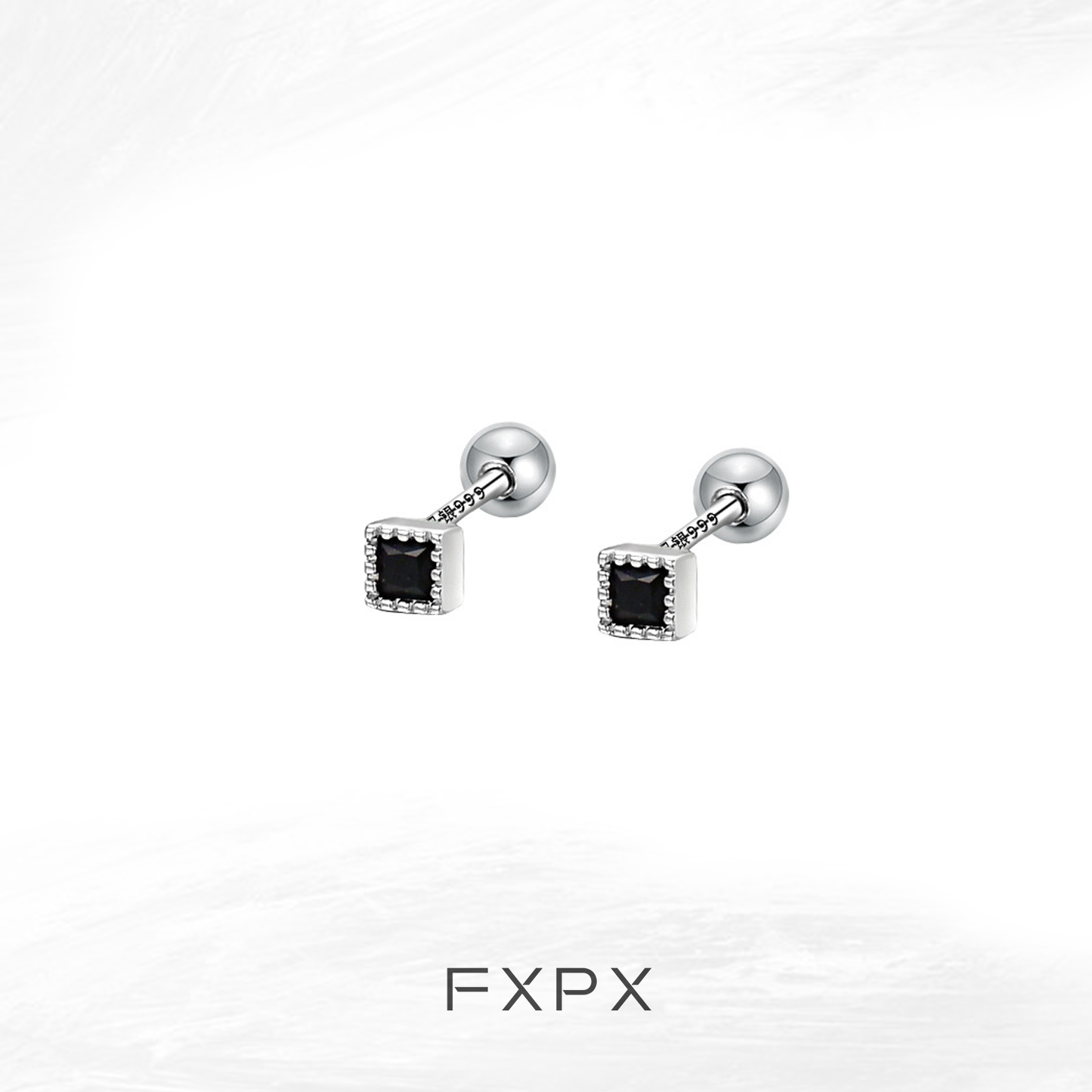 Minimalist black and white earrings featuring a square design with subtle detailing