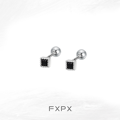 Minimalist black and white earrings featuring a square design with subtle detailing