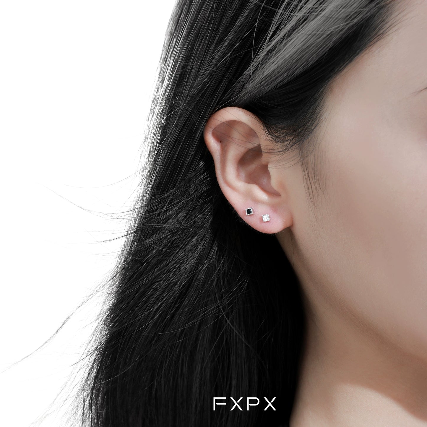 FXPX Minimalist Black and White Earrings displayed on a model's ear for elegant everyday wear