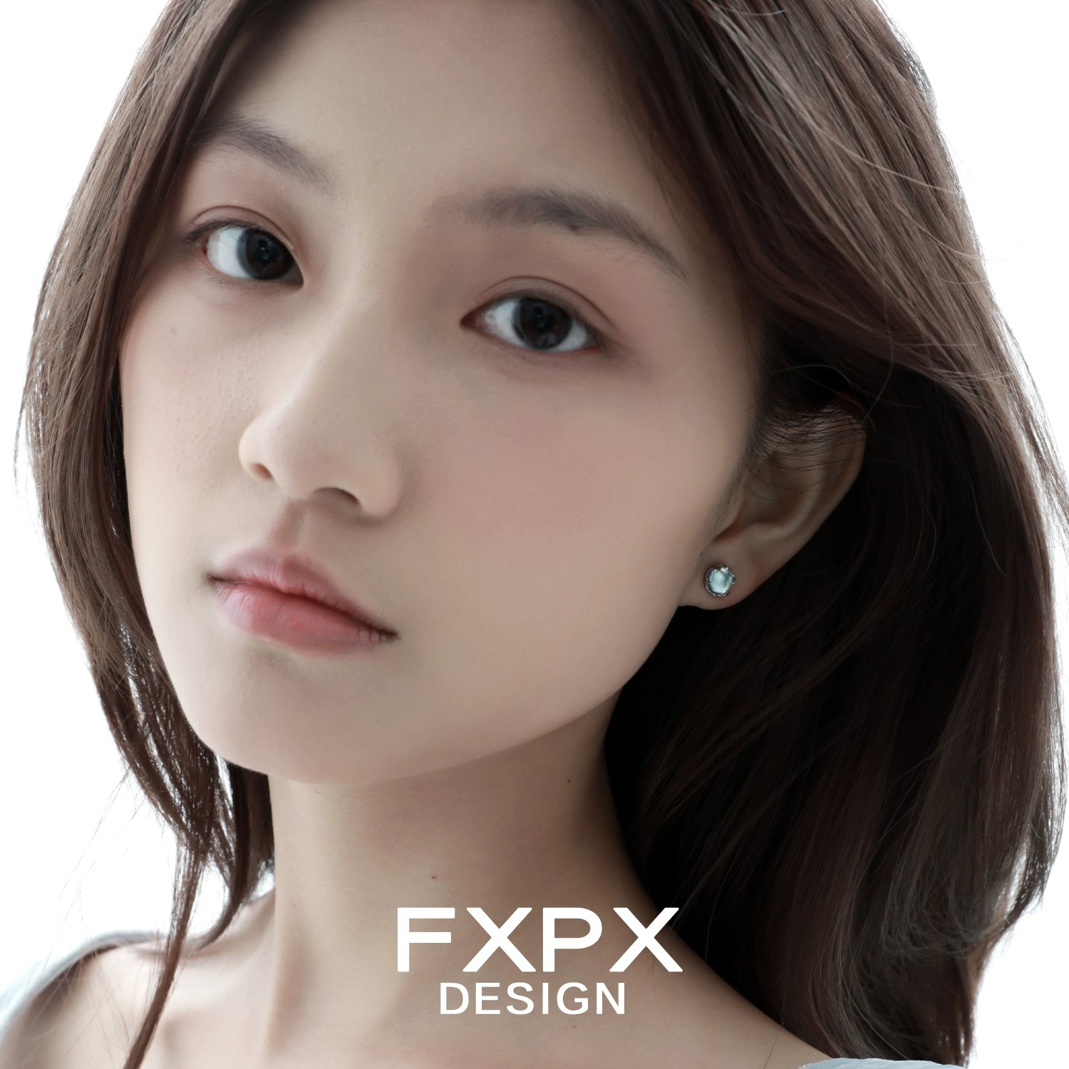 Close-up of a model wearing minimalist glacier earrings by FXPX, showcasing elegant and simple design.