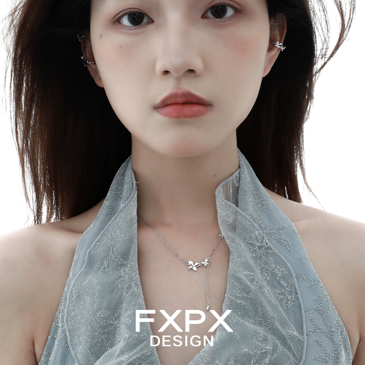 Delicate FXPX mirror butterfly pendant necklace showcased on a model wearing a stylish halter top