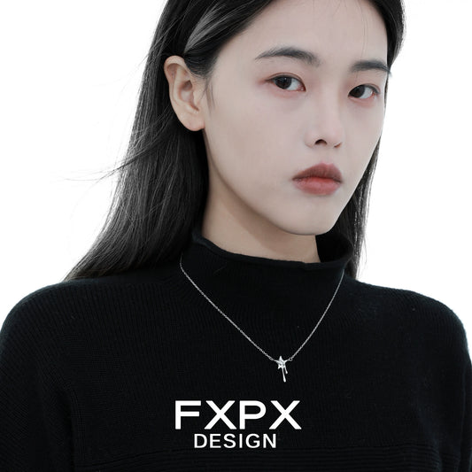 Woman wearing an FXPX moon star silver necklace, showcasing elegant design and charm