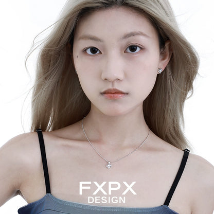 FXPX moonstone heart pendant necklace worn by model with silver chain and minimalist design