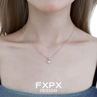 FXPX moonstone heart pendant necklace on a delicate silver chain, perfect for elegant outfits
