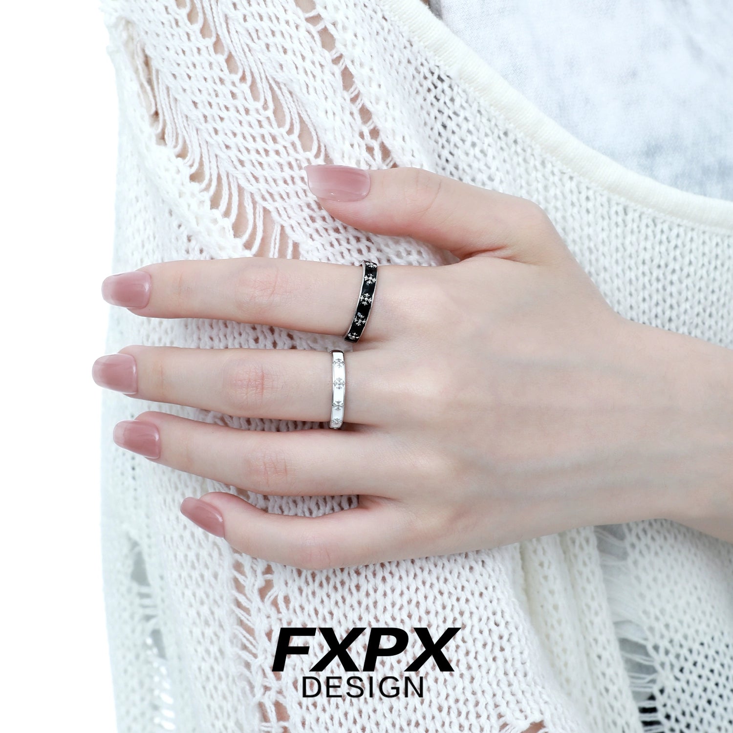 Stylish FXPX mystery couple rings on a hand with a black and white design for matching pairs