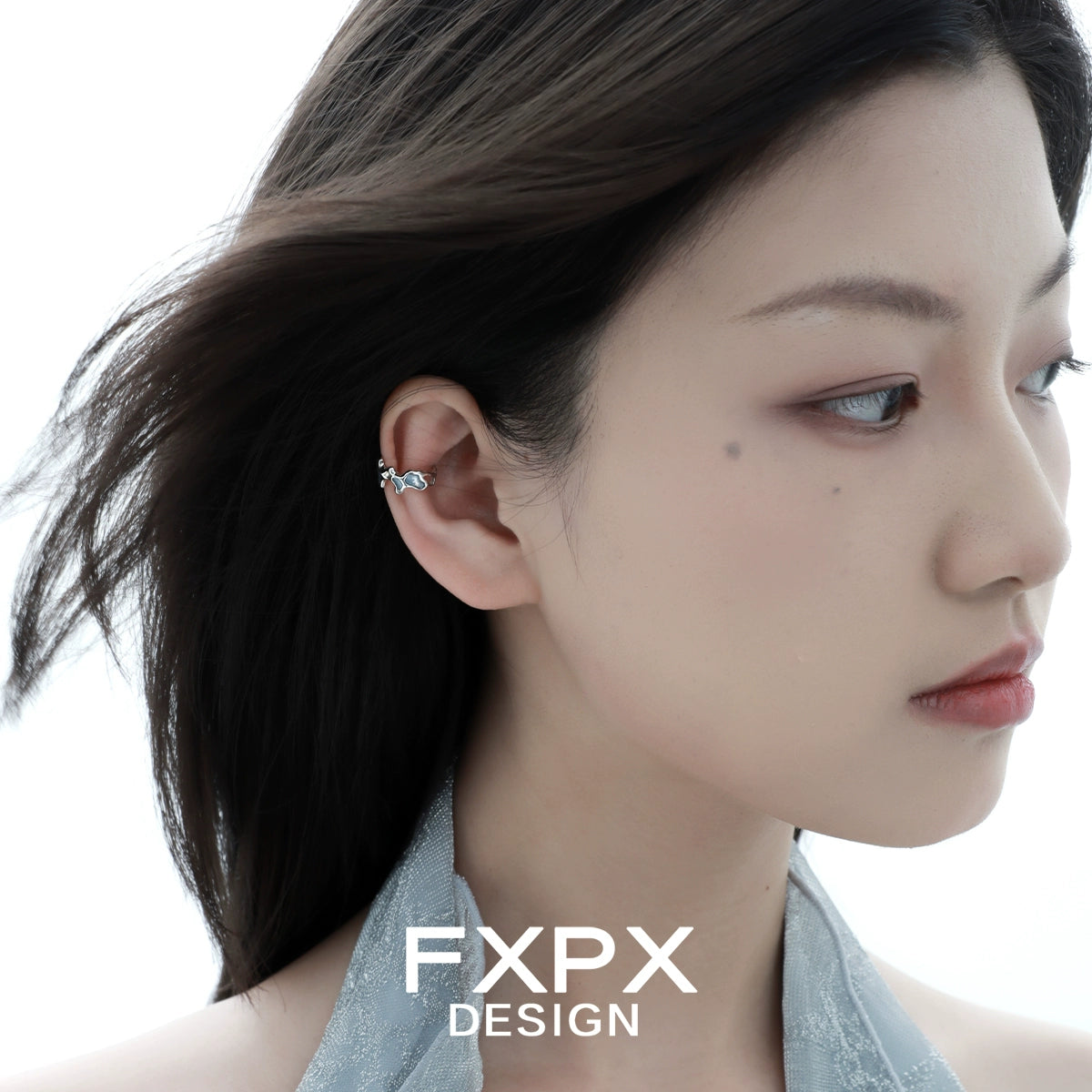 FXPX Mystic Island ear cuff worn elegantly on a model's ear for a stylish look