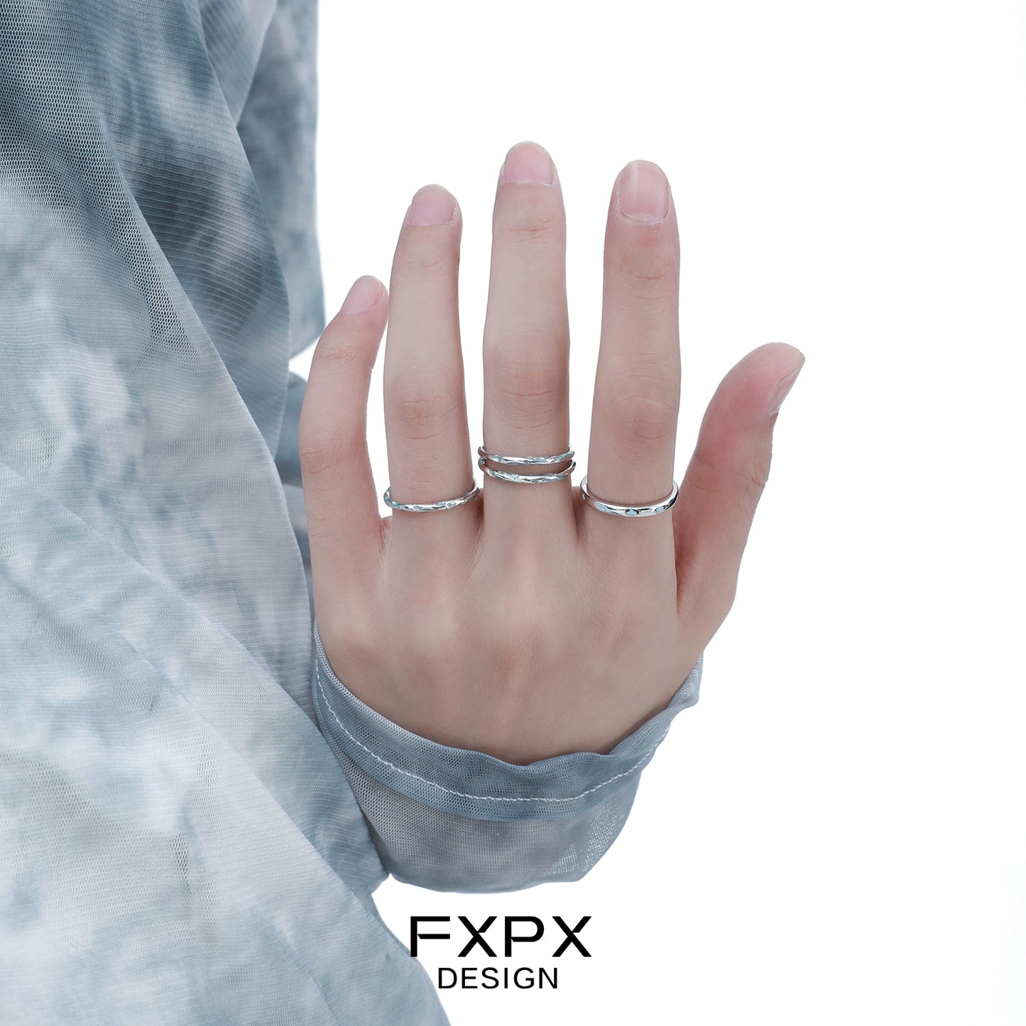 Stylish FXPX Ocean Breeze Ring set worn on hand with elegant silver design