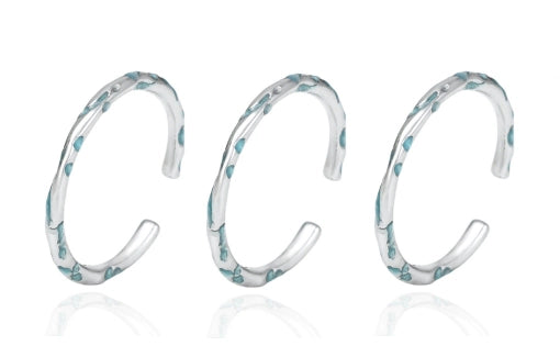 FXPX Ocean Breeze Ring in Silver with Elegant Wave Design and Aqua Accents