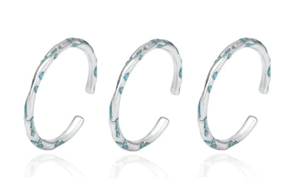 FXPX Ocean Breeze Ring in Silver with Elegant Wave Design and Aqua Accents