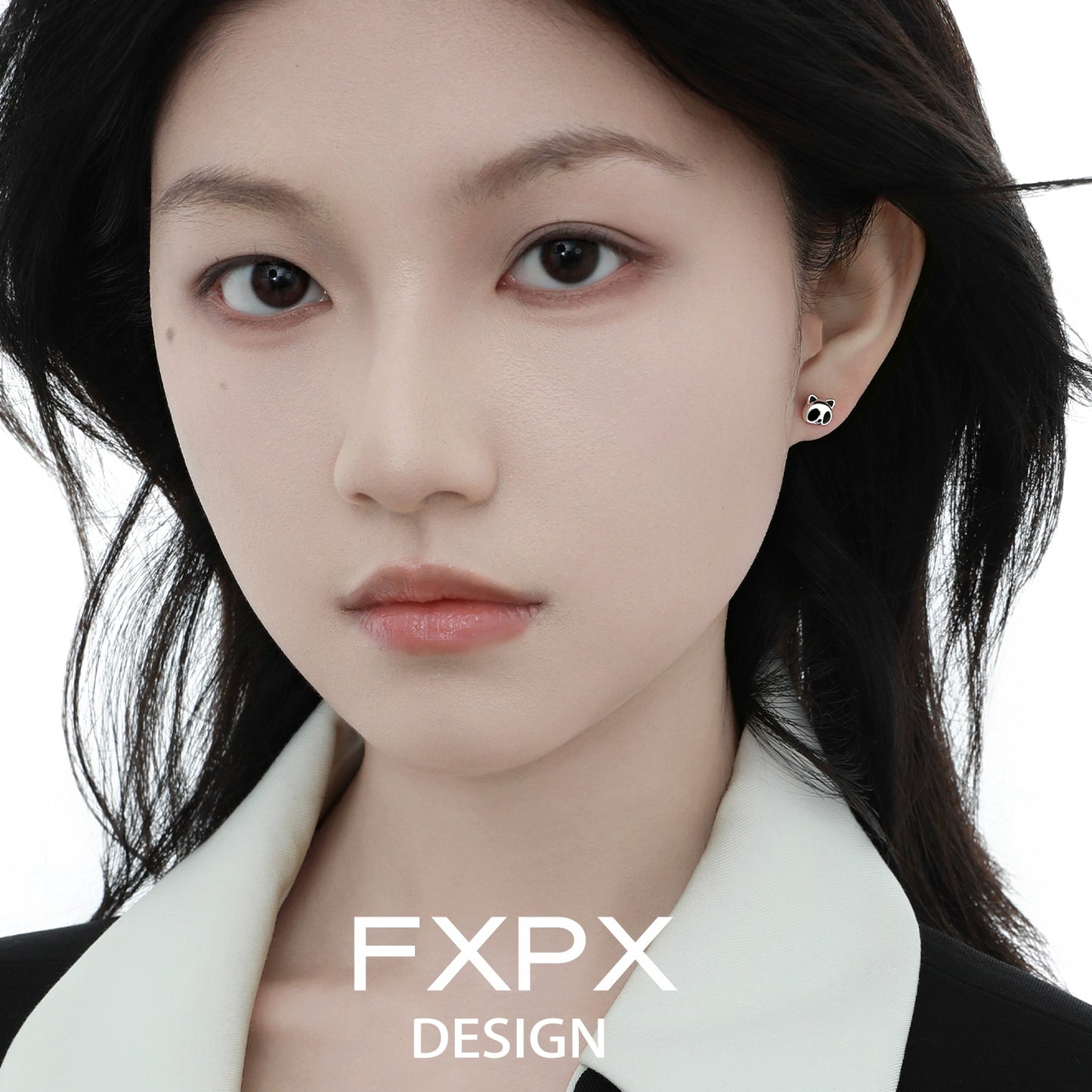 FXPX panda bamboo silver stud earrings showcased on a model with long dark hair