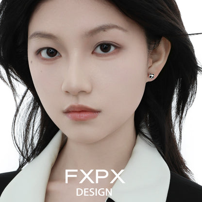 FXPX panda bamboo silver stud earrings showcased on a model with long dark hair